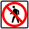 No Pedestrian Crossing~ This sign tells pedestrians that they are not allowed to cross the street at this location.  